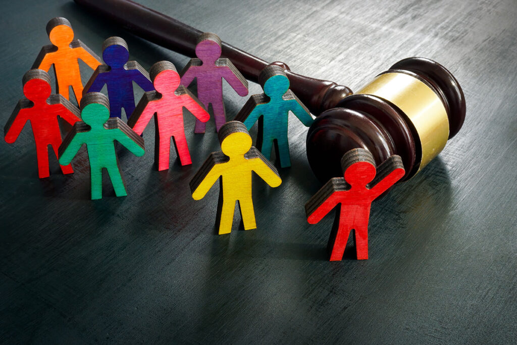small colorful people figurines with judge gavel